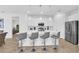 Stylish kitchen featuring stainless appliances, pendant lighting, and breakfast bar seating at 2039 Derwent Dr, Davenport, FL 33896