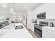 Bright, open kitchen features stainless steel appliances and dining area at 2039 Derwent Dr, Davenport, FL 33896