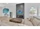 The clubhouse living room features modern decor, a cozy seating area, and large windows for natural light at 2039 Derwent Dr, Davenport, FL 33896