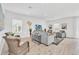 Spacious living room with modern furnishings, neutral tones, and plenty of natural light at 2039 Derwent Dr, Davenport, FL 33896