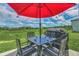 Outdoor patio with seating area overlooking a lush green space, perfect for relaxation and enjoying the view at 2039 Derwent Dr, Davenport, FL 33896