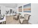 Charming sitting area next to kitchen featuring wicker chairs and an inviting atmosphere at 2039 Derwent Dr, Davenport, FL 33896