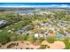 Beautiful aerial view of homes backing to a lush golf course, and a lake in a desirable neighborhood at 2105 Mallory Cir, Haines City, FL 33844