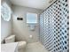 Bathroom featuring a shower and tub, toilet, and tile floors at 2105 Mallory Cir, Haines City, FL 33844
