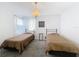 Bedroom featuring two beds, carpeted floors, and a ceiling light at 2105 Mallory Cir, Haines City, FL 33844