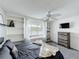 Cozy bedroom featuring a window seat, ceiling fan, and carpeted floors at 2105 Mallory Cir, Haines City, FL 33844