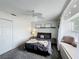 Well-lit bedroom featuring a window seat, ceiling fan, and carpeted floors at 2105 Mallory Cir, Haines City, FL 33844