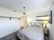 Bright bedroom featuring neutral walls, carpeted floors, and two shelves at 2105 Mallory Cir, Haines City, FL 33844