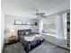 Charming bedroom with a window seat, ceiling fan, and carpeted floors at 2105 Mallory Cir, Haines City, FL 33844