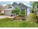 Charming two-story home featuring a well-maintained lawn, meticulous landscaping, and a cozy two-car garage at 2105 Mallory Cir, Haines City, FL 33844