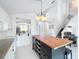 Kitchen with breakfast bar and view to staircase at 2105 Mallory Cir, Haines City, FL 33844
