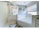 Ensuite bathroom with bathtub, glass enclosed shower and window for natural light at 2105 Mallory Cir, Haines City, FL 33844