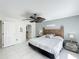 Well lit main bedroom with tiled floors, fan and ensuite access at 2105 Mallory Cir, Haines City, FL 33844