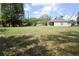 Large grassy backyard perfect for outdoor activities and relaxation at 214 Kay St, Auburndale, FL 33823