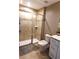 Modern bathroom with a glass-enclosed shower, white cabinets, and neutral color palette at 214 Kay St, Auburndale, FL 33823