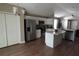 Open kitchen featuring stainless steel appliances, granite countertops, and a central island at 214 Kay St, Auburndale, FL 33823