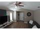 Comfortable living room featuring wood floors, ceiling fan, and stylish decor at 214 Kay St, Auburndale, FL 33823