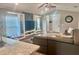 Open-concept living room with modern built-ins, vaulted ceilings, and vinyl flooring throughout at 214 Kay St, Auburndale, FL 33823
