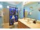 Bathroom with Star Wars-themed decor, shower, and vanity at 215 Cordova Ave, Davenport, FL 33897