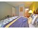 Bedroom features a decorative bed and colorful design accents at 215 Cordova Ave, Davenport, FL 33897