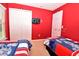 Bedroom featuring two beds, Mickey Mouse themed decorations and a window at 215 Cordova Ave, Davenport, FL 33897