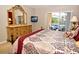Comfortable bedroom with large dresser and views of the outdoor living area at 215 Cordova Ave, Davenport, FL 33897