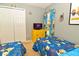 Bedroom features two beds, Minion themed decorations and a window at 215 Cordova Ave, Davenport, FL 33897