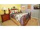 Bedroom with decorative bed and side tables, plus TV and wall art at 215 Cordova Ave, Davenport, FL 33897