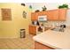 Bright kitchen with appliances and a spacious breakfast bar at 215 Cordova Ave, Davenport, FL 33897