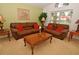 Comfortable living room with plush sofas, warm lighting, and a picturesque view at 215 Cordova Ave, Davenport, FL 33897