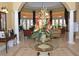Welcoming lobby area with tile flooring, high ceilings, columns, and comfortable seating at 215 Cordova Ave, Davenport, FL 33897