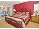 Comfortable primary bedroom with a plush king-sized bed, ensuite bathroom, and private balcony access at 215 Cordova Ave, Davenport, FL 33897