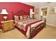 Comfortable primary bedroom featuring a stylish bed, elegant decor, and ample natural light at 215 Cordova Ave, Davenport, FL 33897