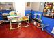 Finished room featuring toddler play area with toys and comic book art at 215 Cordova Ave, Davenport, FL 33897