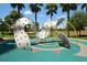 Modern playground area with colorful equipment and soft ground covering at 215 Cordova Ave, Davenport, FL 33897