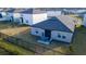 Aerial view of backyard with patio, outdoor furniture, and black fence at 2166 Derwent Dr, Davenport, FL 33896