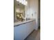 Modern bathroom features dual sinks, granite countertops, and neutral finishes at 2166 Derwent Dr, Davenport, FL 33896