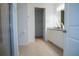 Bright bathroom boasts sleek vanity, neutral tile, and separate walk-in shower at 2166 Derwent Dr, Davenport, FL 33896