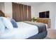 A cozy bedroom features a plush bed with bedside tables, a dresser, and carpet flooring for a comfortable retreat at 2166 Derwent Dr, Davenport, FL 33896