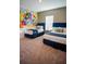 Charming bedroom features twin beds, colorful Disney mural, and natural light at 2166 Derwent Dr, Davenport, FL 33896