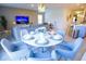 Enjoy the open-concept living with an adjacent dining space and view of the entertainment area in this modern layout at 2166 Derwent Dr, Davenport, FL 33896