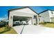 Spacious two-car garage with modern doors offers ample parking and storage for your vehicles and belongings at 2166 Derwent Dr, Davenport, FL 33896