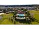 Stunning aerial view of community pool, lined with palms, and ample seating at 2166 Derwent Dr, Davenport, FL 33896