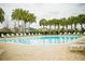 Inviting community pool with lounge chairs, perfect for relaxation and socializing at 2166 Derwent Dr, Davenport, FL 33896