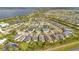 An aerial view of a planned community featuring manicured lawns and access to a large lake at 2460 Promenade Dr, St Cloud, FL 34772
