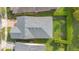Overhead view of a home with a well-maintained roof, lawn, and landscaping, creating a visually appealing property at 2460 Promenade Dr, St Cloud, FL 34772