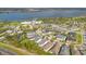 A planned community shown from above, featuring many amenities and a view of a scenic lake at 2460 Promenade Dr, St Cloud, FL 34772
