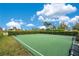 Outdoor basketball court with well-maintained surface, surrounded by greenery and seating for spectators at 2460 Promenade Dr, St Cloud, FL 34772