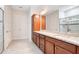 Bathroom featuring a large vanity with double sinks and a glass shower enclosure at 2460 Promenade Dr, St Cloud, FL 34772