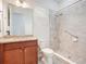 Bathroom features a walk-in shower, and a granite top vanity at 2460 Promenade Dr, St Cloud, FL 34772